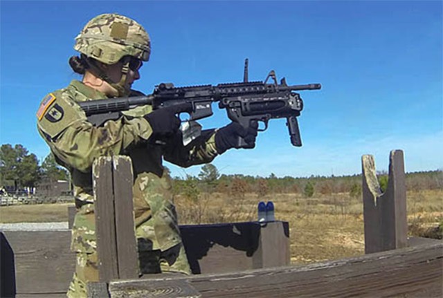 Sgt. Keala Burks fires a round during training on the M320 grenade launcher. 