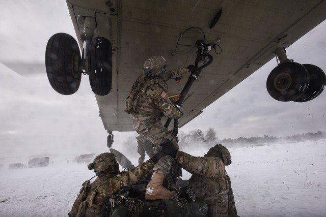 12th CAB and 2CR sling load howitzers in the Grafenwoehr snow