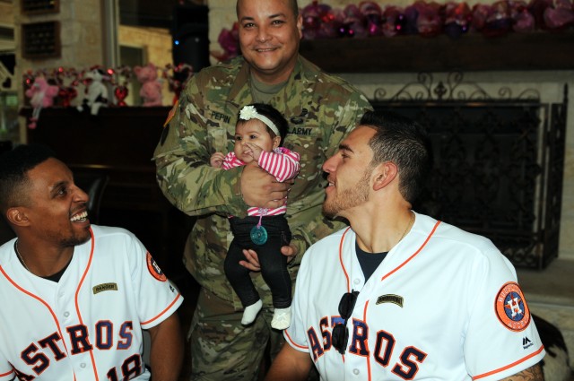 Soldier introduces baby to Houston Astros
