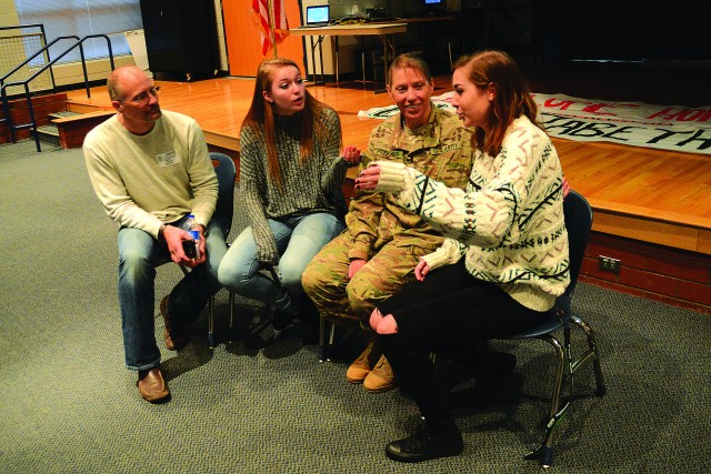 Army mom returning from deployment surprises daughters