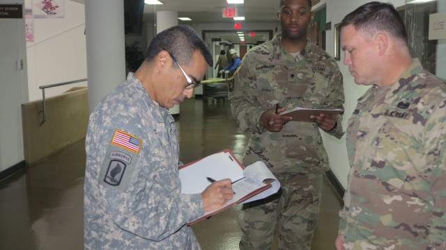 Lt. Col. Ruiz reviews Soldier records