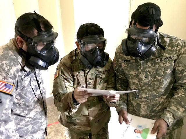 Soldiers from Headquarters and Headquarters Company, 301st Maneuver Enhancement Brigade, read a series of phrases to ensure the fit and breathability of the M50 Joint Service General Purpose Mask