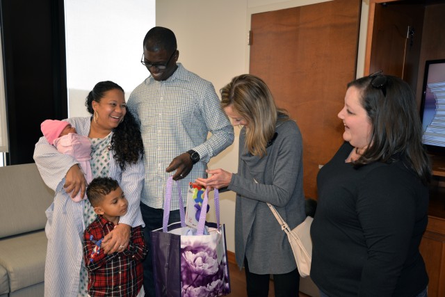 Family receives layette bag at GLWACH MCU