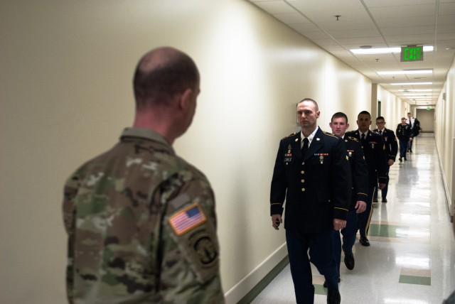 Competitors make their way towards the interview board portion of the 301st Maneuver Enhancement Brigade Best Warrior competition