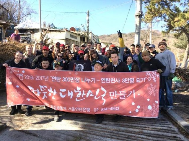 Soldiers deliver coal briquettes to elderly community
