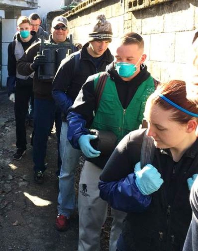 Soldiers deliver coal briquettes to elderly community