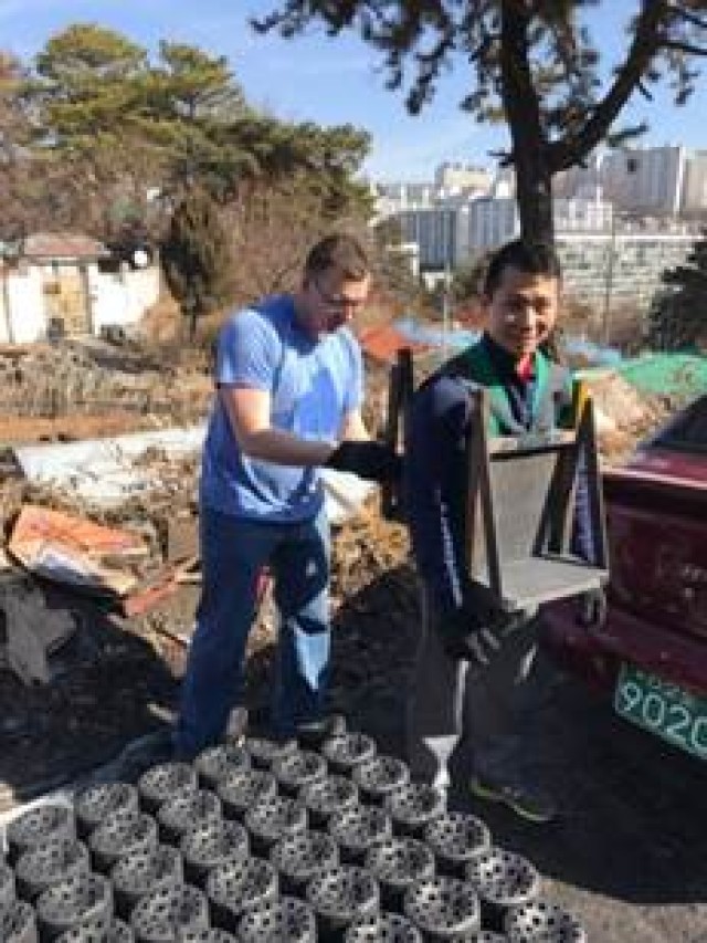 Soldiers deliver coal briquettes to elderly community