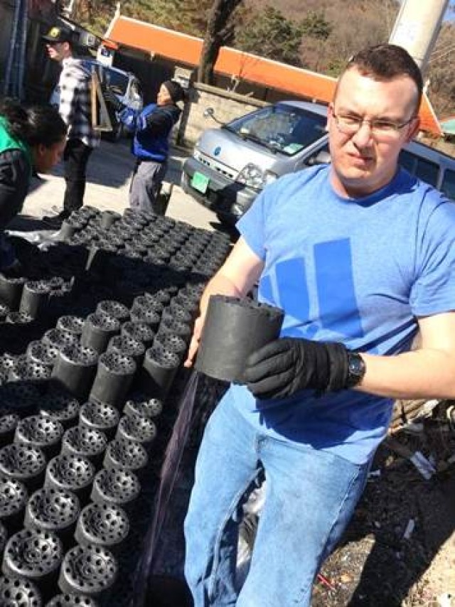 Soldiers deliver coal briquettes to elderly community