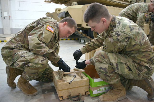 1st Bn., 66th Armor Regt. Install Abram reactive armor tiles