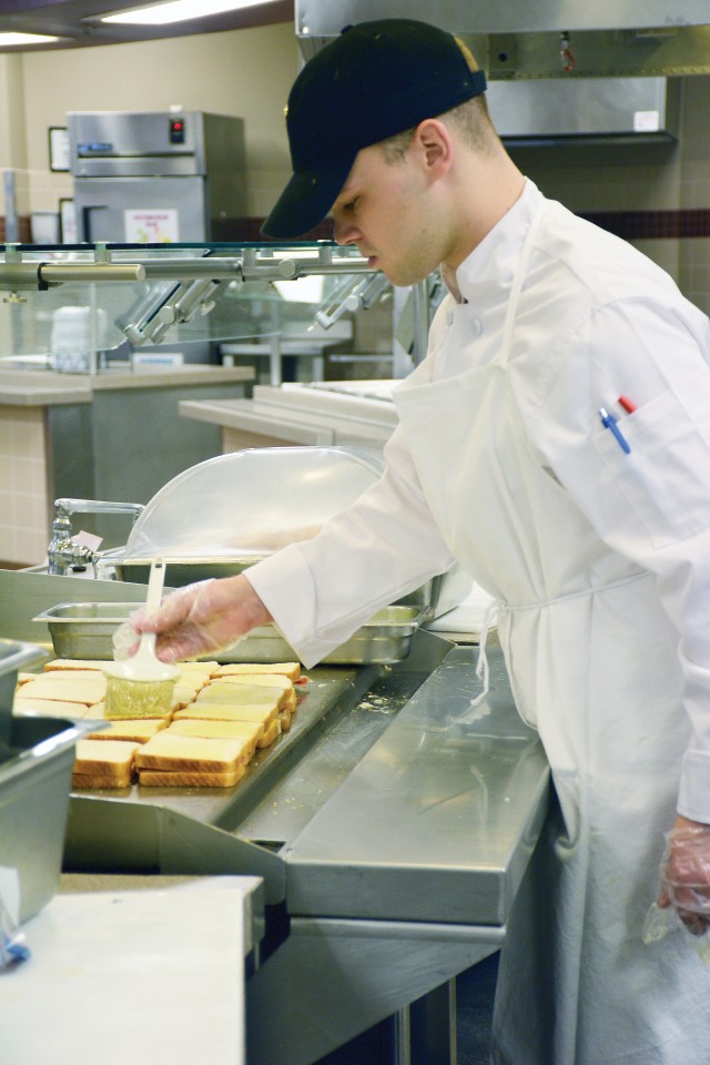 Culinary specialists with the 1st Infantry Division at Fort Riley practice their profession in new uniforms.