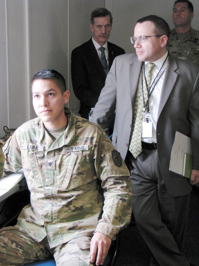 Spec Lara briefs Riley Ops