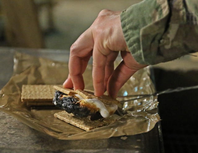 Soldiers deployed to Iraq enjoy a fun night of s'mores