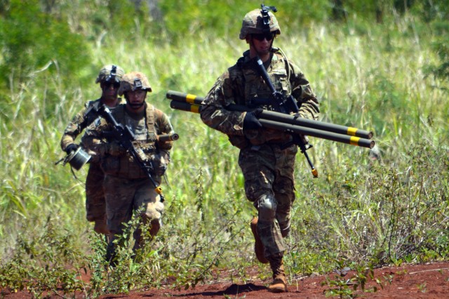 Combat engineers demolish obstacles with Bangalore torpedoes