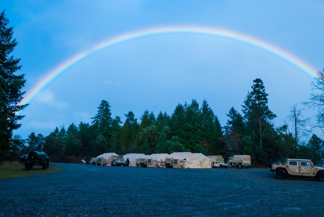 A color spectrum rises above the 301st Maneuver Enhancement Brigade tactical operations center on Joint Base Lewis-McChord, Washington