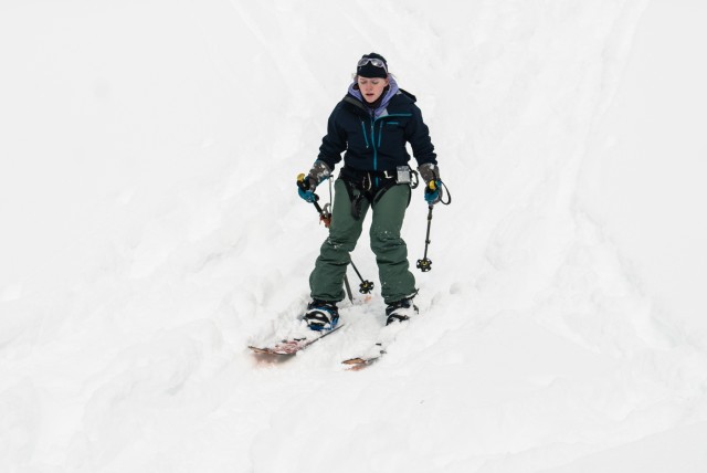 Emily Rossin uses a splitboard to navigate snow-covered terrain during the practical portion of the JBLM Alpine Club basic alpine course, at Mount Rainier National Park, Washington