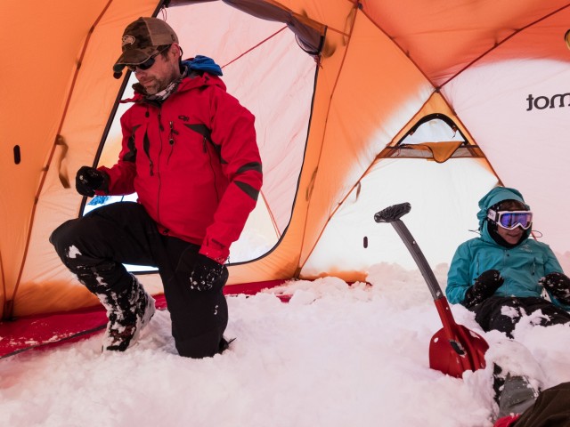 Students prepare the sleeping areas inside their tent at Mount Rainier National Park, Washington
