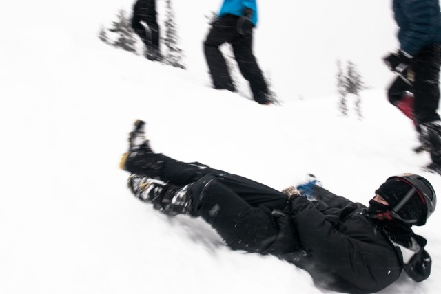 A student practices self-arrest techniques at the JBLM Alpine Club basic alpine course, Mount Rainier National Park, Washington