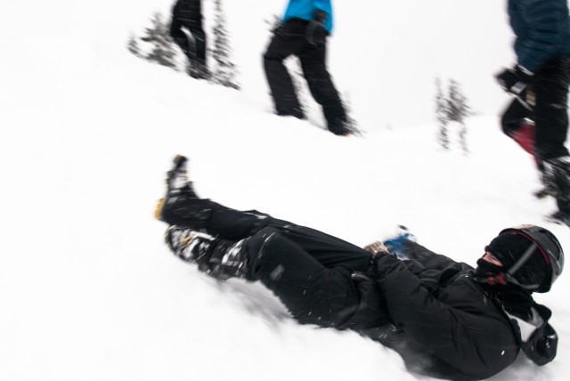 A student practices self-arrest techniques at the JBLM Alpine Club basic alpine course, Mount Rainier National Park, Washington