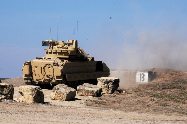 Members of Company C, 2nd Combined Arms Battalion, 137th Infantry Regiment, Kansas National Guard, train on a newer version of the Bradley Fighting Vehicle at Fort Riley, Kansas, March 8 to 16.