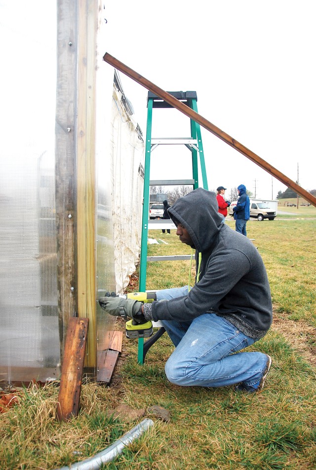 A team of local Fort Riley volunteers, including personnel of the Warrior Transition Battalion and a representative from Kansas AgrAbility with Kansas State University Research and Extension, construc