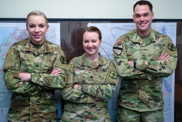 Geospatial engineers pose for a photograph at 301st Maneuver Enhancement Brigade headquarters