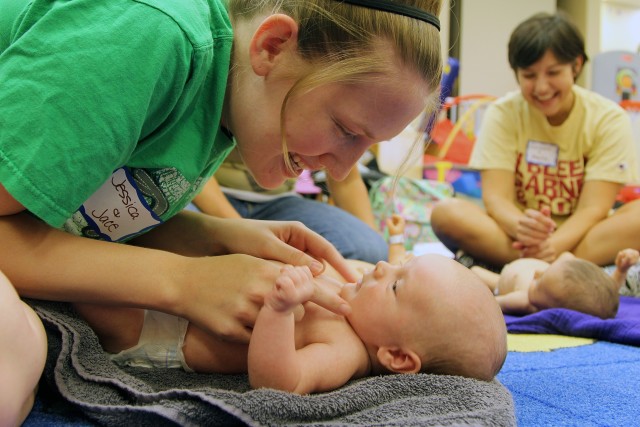 Infant massage bonds babies, parents