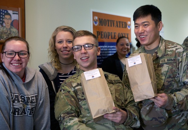 Signal Battalion Families welcome Soldiers home from Key Resolve with smiles and snacks