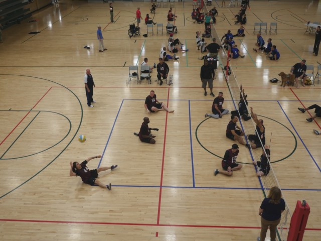 Standing or sitting, the volleyball is still bumped, set, and spiked