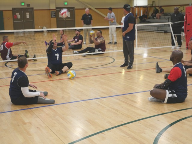 Standing or sitting, the volleyball is still bumped, set, and spiked
