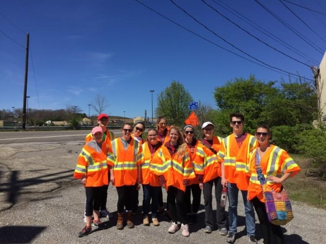 Volunteers in orange vests