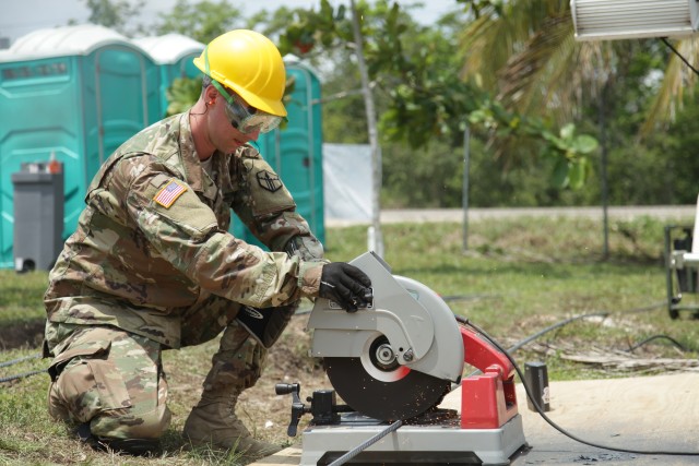 U.S. Army Spc. Steph Jones cuts rebar