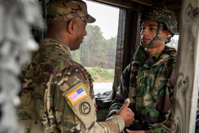 Sgt. 1st Class Vincent Johnson gives Spc. Kyllo Laird a few words of advice