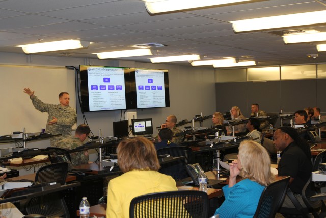 Maj. Arnold talks to educators and recruiters