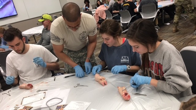 Munson Army Health Center physicians teach the art of suturing