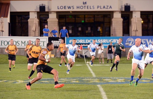 Mattie Tago advances the ball in the gold-medal game of the 2013 Armed Forces Rugby Sevens Championships