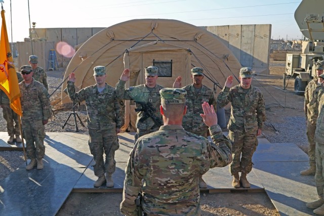 Maj. Gen. Martin reenlists four Soldiers during a battlefield circulation