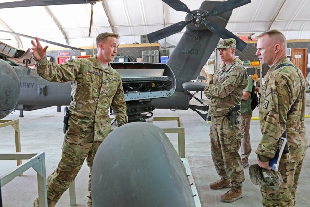 Maj. Gen. Martin talks with a Soldier about an aircraft during a battlefield circulation