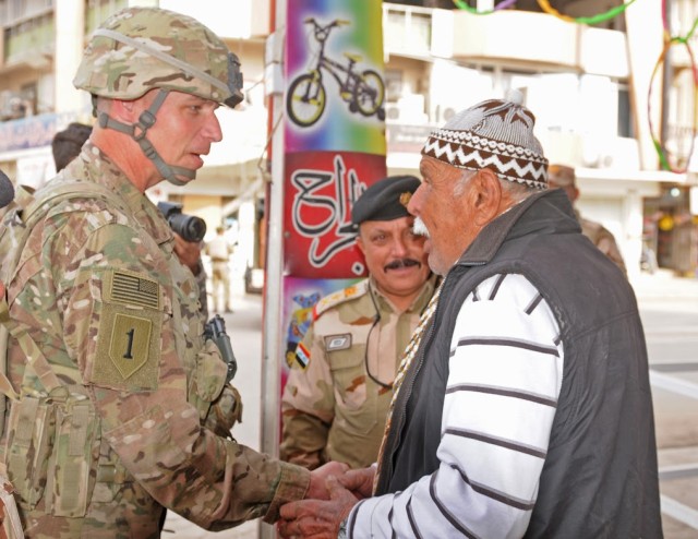 Maj. Gen. Martin talks with an elderly resident of East Mosul during a trip to Mosul