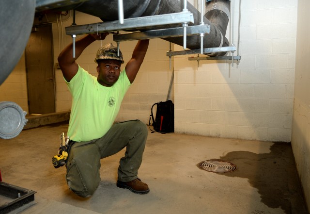 Soldier trades helmet for hard hat
