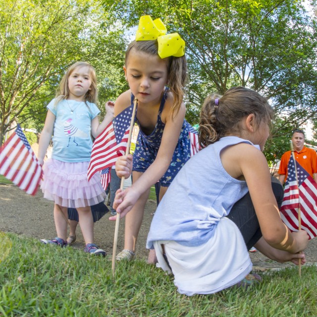 Little girls and American flags