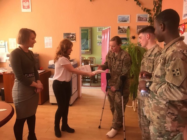 3-29 FA Soldiers befriend Polish children during school visits
