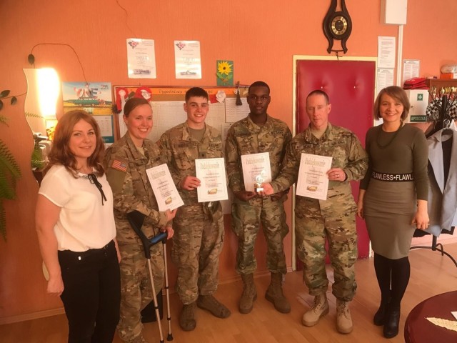 3-29 FA Soldiers befriend Polish children during school visits