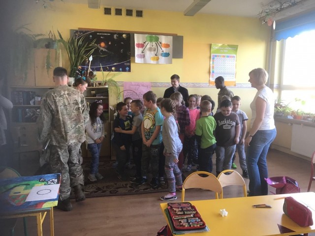 3-29 FA Soldiers befriend Polish children during school visits
