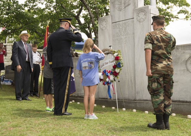 Community pauses to honor heroes