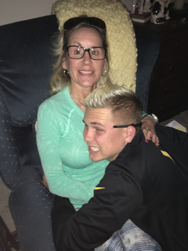 Army mom and son share hug after injury