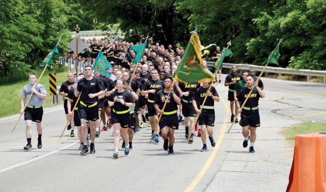 Personnel from the 97th Military Battalion and 10th Air Support Operations Squadron at Fort Riley, Kansas, participate in the 35th annual Law Enforcement Torch Run June 1 in support of Special Olympic