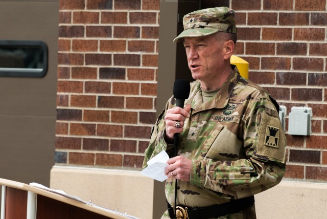 Brig. Gen. John J. Elam addresses Soldiers, friends and family members of the 301st Maneuver Enhancement Brigade
