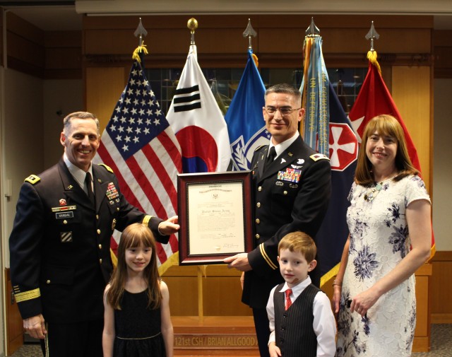 Col. Lee Burnett poses with family during his promotion ceremony