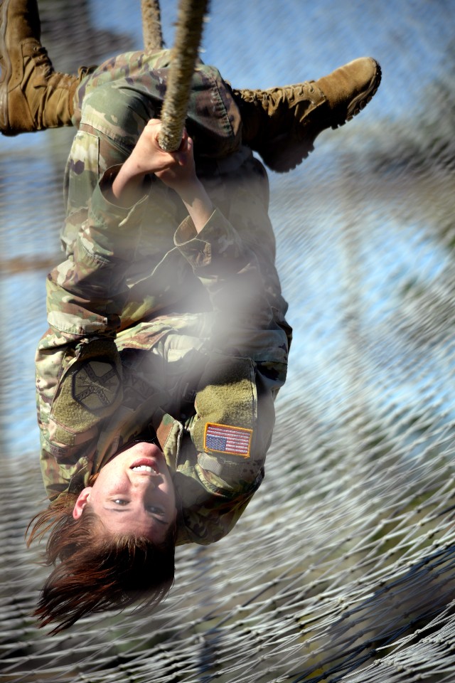 Spc. Lillian Lewis hangs tough on obstacle course