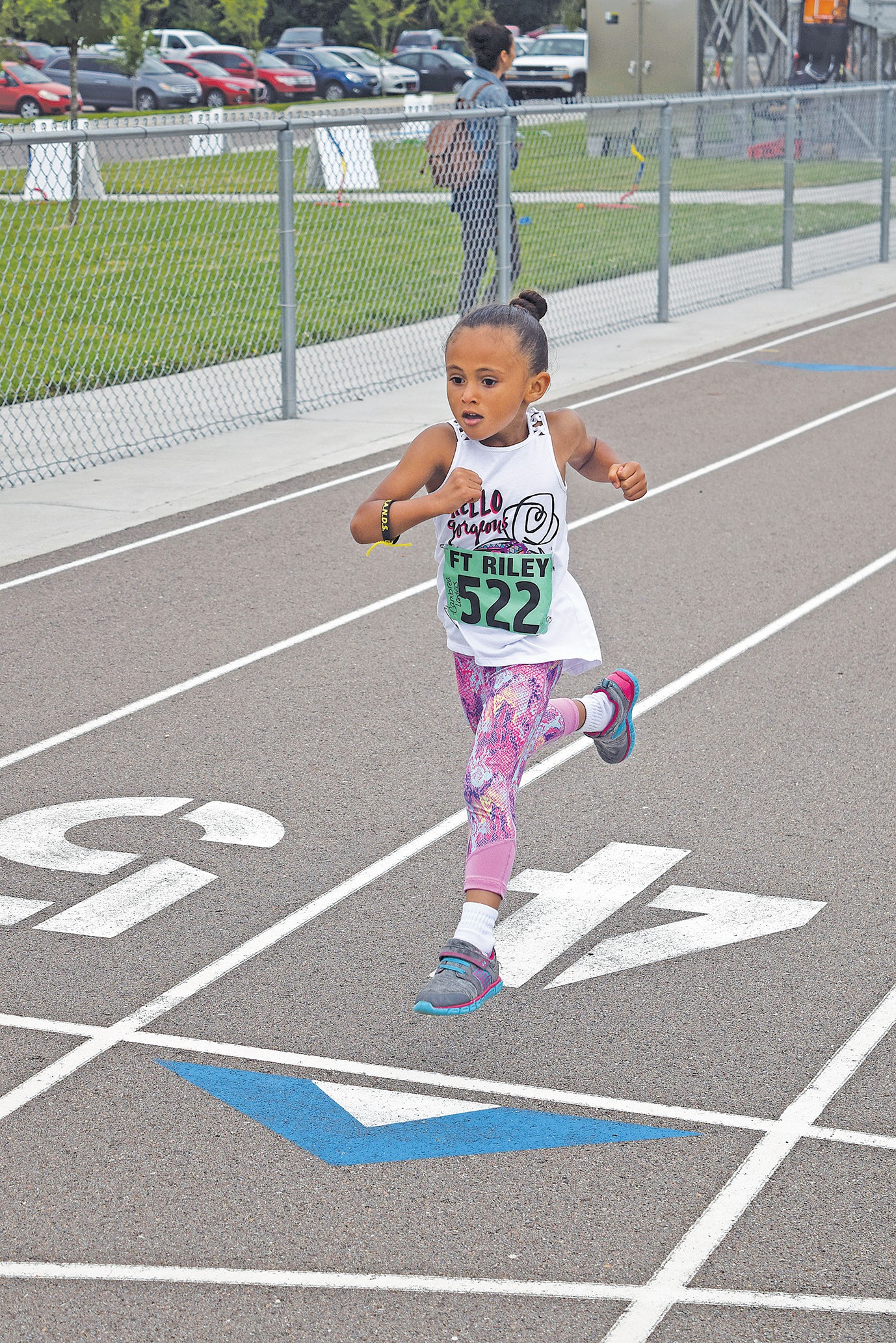 little girl running a race